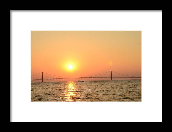Mackinac Bridge Framed Print featuring the photograph sunset over Mackinac Bridge by Brett Geyer