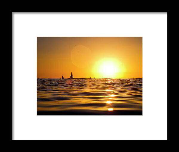 Beauty In Nature Framed Print featuring the photograph Sunset Over The Water In Waikiki by Elyse Butler