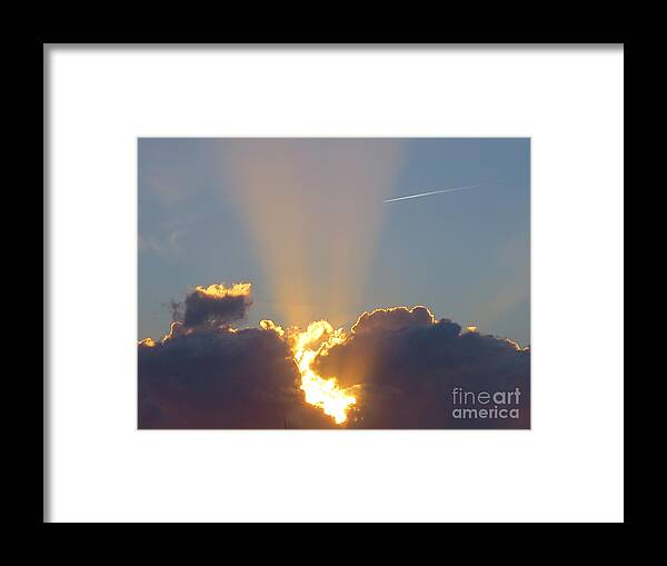 Sunset Rays Bursting Through The Clouds With Jet Stream From Aircraft. Framed Print featuring the photograph Sunset rays bursting through the clouds with jet stream from aircraft. by Robert Birkenes