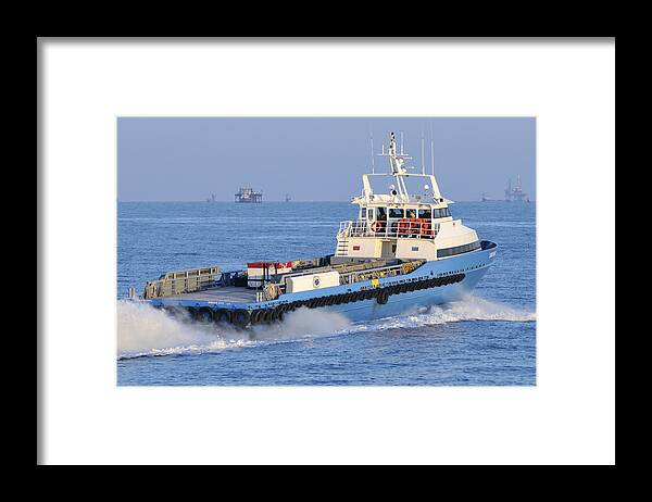 Supply Vessel Framed Print featuring the photograph Supply Vessel heads to sea by Bradford Martin