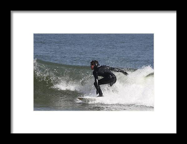 Surfer Hitting The Curl Framed Print featuring the photograph Surfer Hitting the Curl by John Telfer