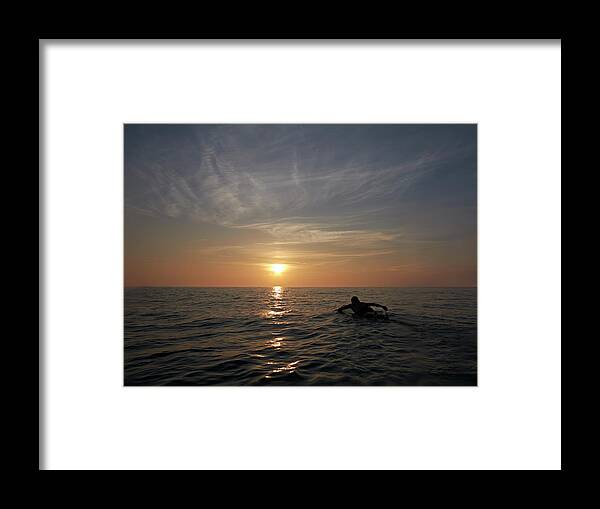 People Framed Print featuring the photograph Surfer Paddling Out Toward Sunset by Dougal Waters