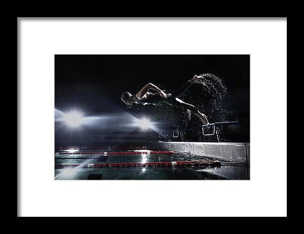 People Framed Print featuring the photograph Swimmer Jumping From Starting Platform by Stanislaw Pytel