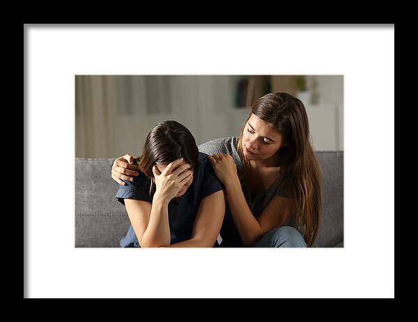 Problems Framed Print featuring the photograph Teen comforting hes sad friend in the night by AntonioGuillem