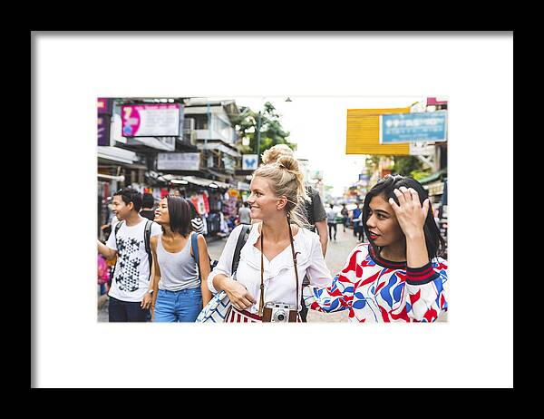 Young Men Framed Print featuring the photograph Thailand, Bangkok, Khao San Road, group of friends exploring the city by Westend61