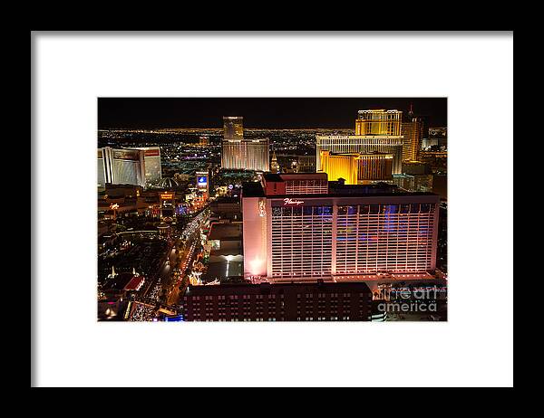 Flamingo Framed Print featuring the photograph The Flamingo and The Vegas Strip by Eddie Yerkish
