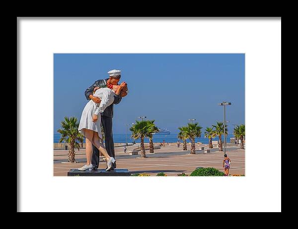 Kiss Framed Print featuring the photograph The Kiss by ML Jones