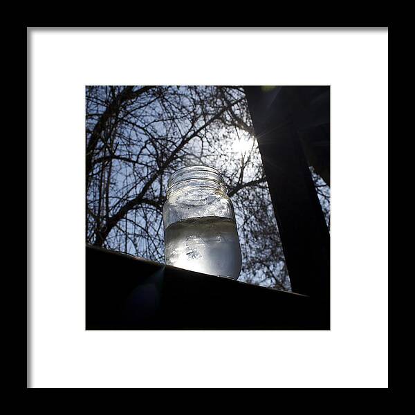 A Jar On A Piece Of Wood. Sun Seeping Through The Trees Along With Trees In The Background. Very Detailed. Framed Print featuring the photograph The Lonely Jar by Stella Robinson