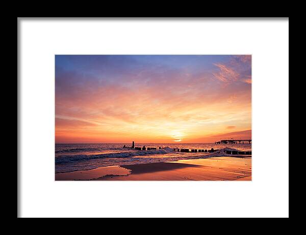 Scenics Framed Print featuring the photograph The sun rising at the beach in the morning by Rike_