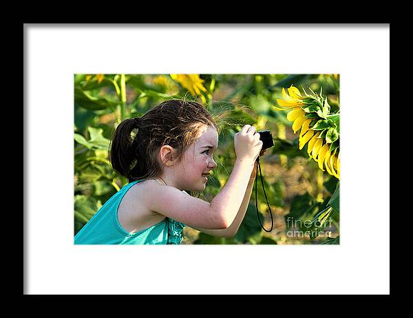 Young Girl In Sunflowers Framed Print featuring the photograph The Sunny Side by Jim Garrison