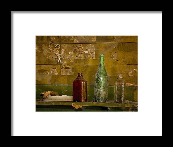 Bottles On Mantel Framed Print featuring the photograph Three Bottles on a Mantel by Sandra Anderson