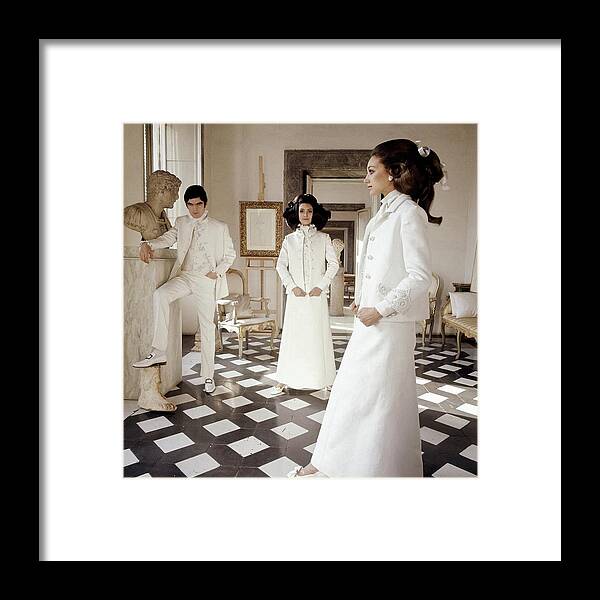 Accessories Framed Print featuring the photograph Three Models Wearing Clothing By Valentino by Henry Clarke