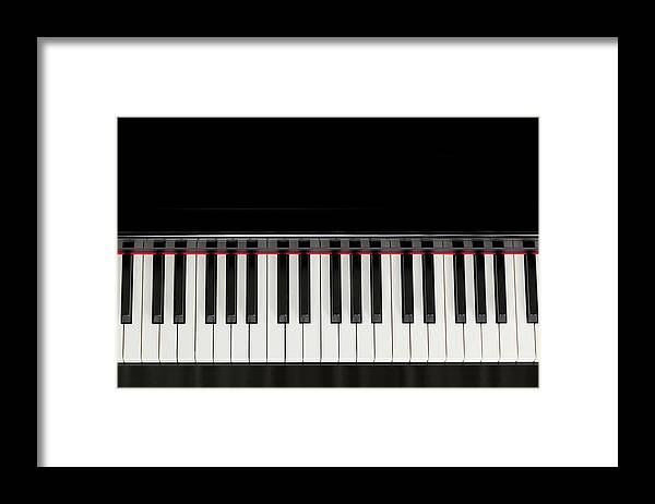 Piano Framed Print featuring the photograph Top View Black Piano Keyboard by Amriphoto