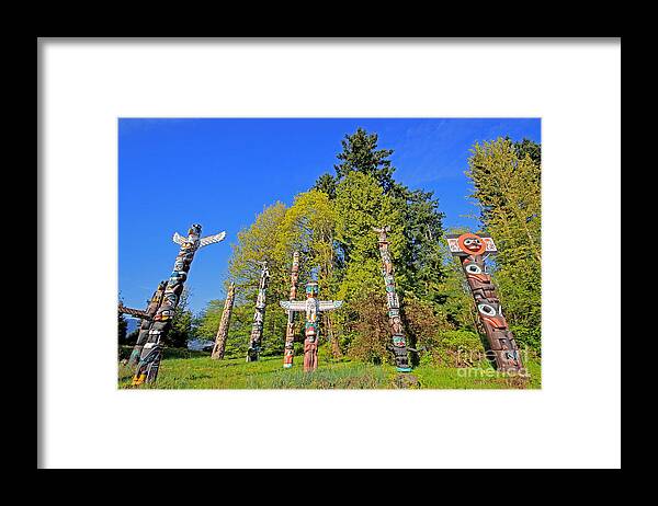 Vacouver Framed Print featuring the photograph Totem Poles in Stanley Park by Charline Xia