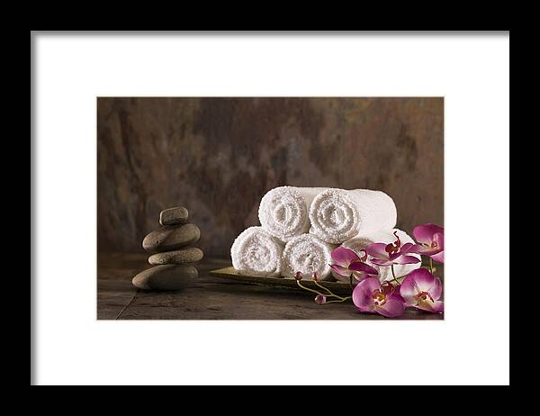 Spa Framed Print featuring the photograph Towels, flowers, and stones by Comstock Images