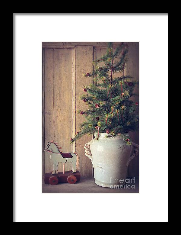 Decoration Framed Print featuring the photograph Toy horse with Christmas tree on table by Sandra Cunningham