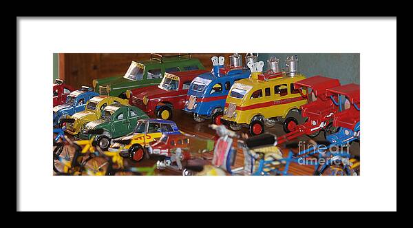 Prott Framed Print featuring the photograph toys made of waste in Madagascar 1 by Rudi Prott