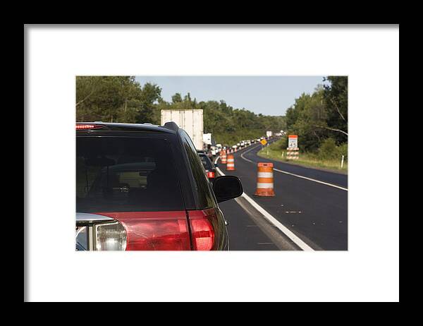 Traffic Cone Framed Print featuring the photograph Traffic On The Roadwork Distance by Alex Potemkin
