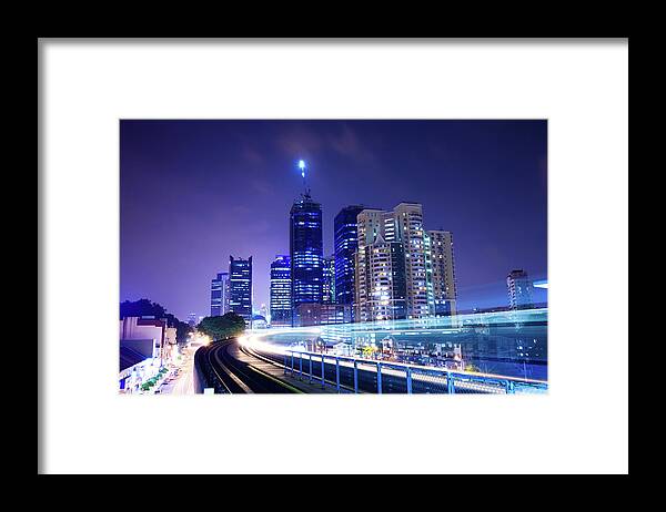 People Framed Print featuring the photograph Train Through City With Blur Trail by Loveguli