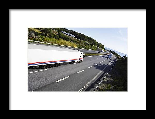 Truck Framed Print featuring the photograph Trucks On Scenic Freeway by Christian Lagereek