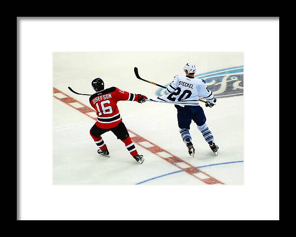 Hockey Framed Print featuring the photograph Tugging on the Jersey by James Kirkikis