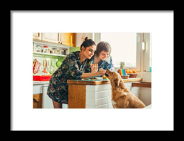 Pets Framed Print featuring the photograph Two females enjoing breakfast at home by Obradovic