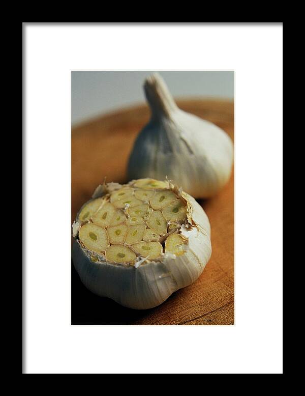 Fruits Framed Print featuring the photograph Two Heads Of Garlic by Romulo Yanes