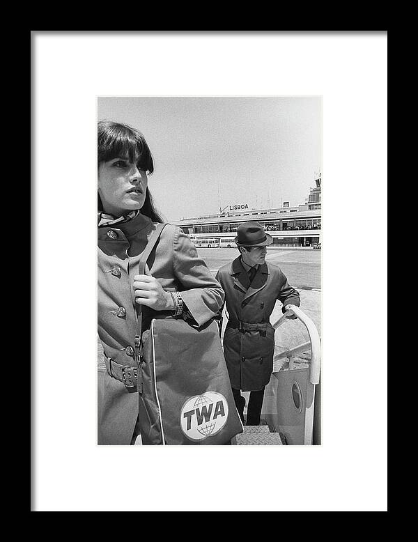 Fashion Framed Print featuring the photograph Two Models Boarding A Plane by Leonard Nones