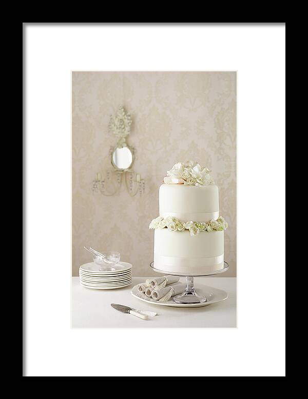 Coral Colored Framed Print featuring the photograph Two Tier Wedding Cake With Knife And by Brett Stevens