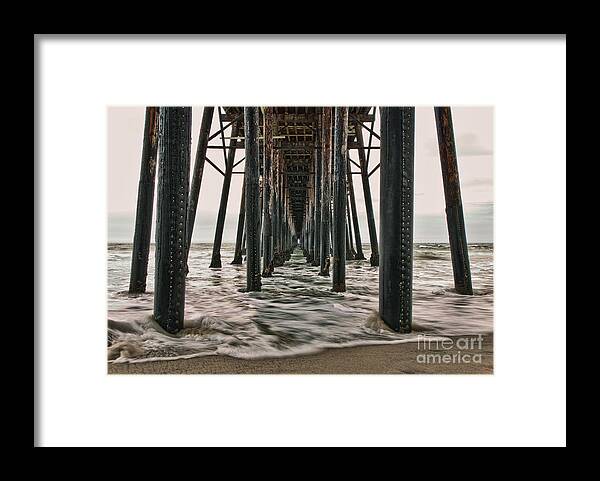 Under The Pier Framed Print featuring the photograph Under The Pier by Eddie Yerkish