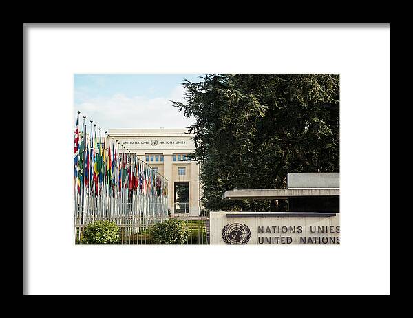 In A Row Framed Print featuring the photograph United Nations by Stefan Cristian Cioata