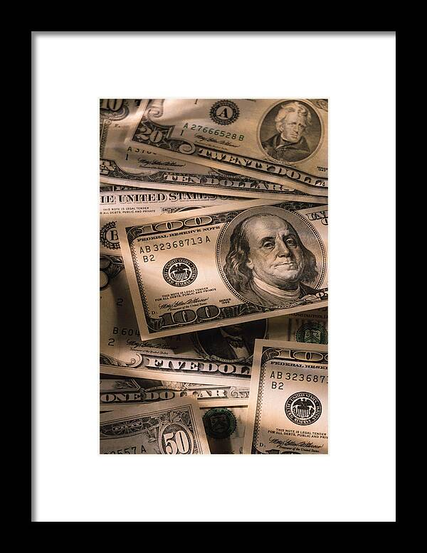 Finance Framed Print featuring the photograph US dollar bills by Comstock