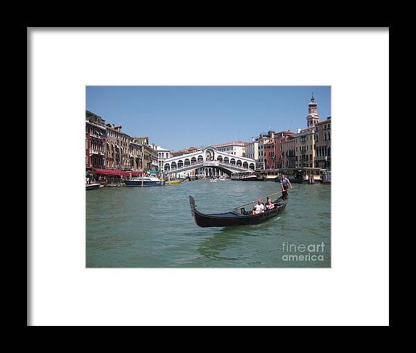 Venice Gondolier Framed Print featuring the photograph Venice Gondolier by John Malone