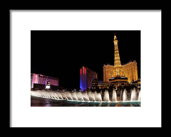 Vibrant Las Vegas Framed Print featuring the photograph Vibrant Las Vegas - Bellagio's Fountains Paris Bally's and Flamingo by Georgia Mizuleva
