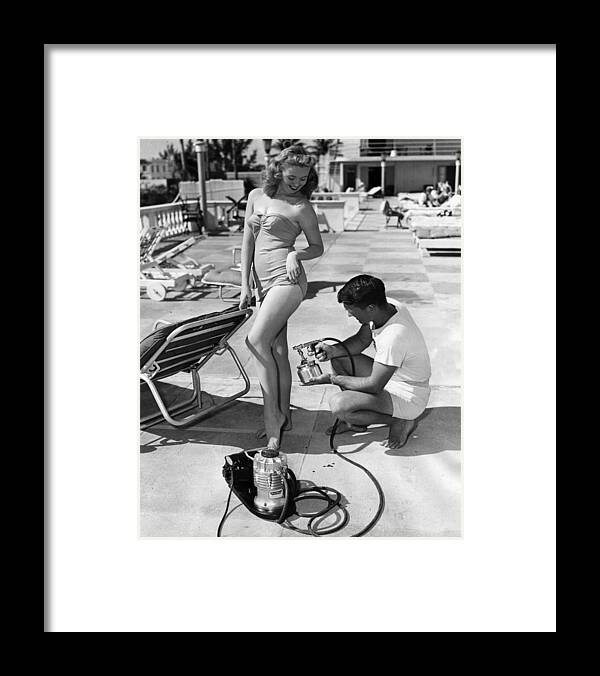 Beauty Framed Print featuring the photograph Vintage Spray Tan Modeling by Retro Images Archive