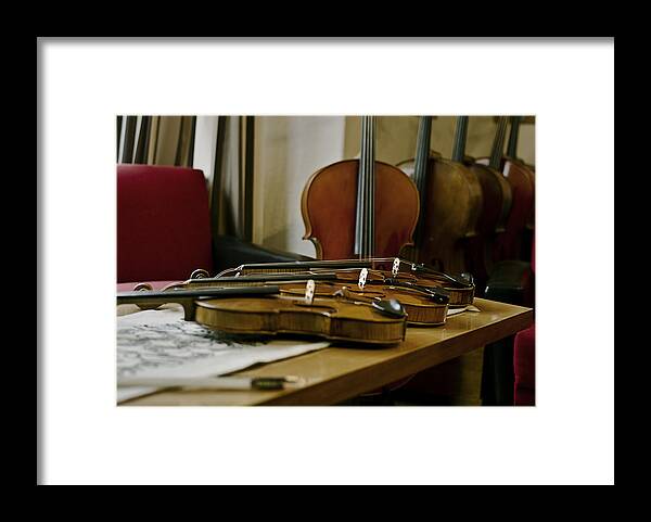 Violin Framed Print featuring the photograph Violins by Urte Berteskaite