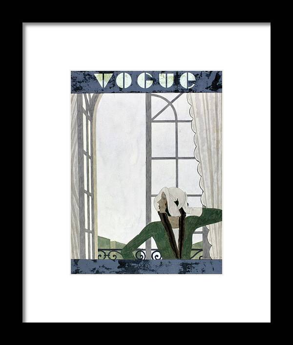 Exterior Framed Print featuring the digital art Vogue Cover Featuring A Woman Beside An Open by Pierre Mourgue