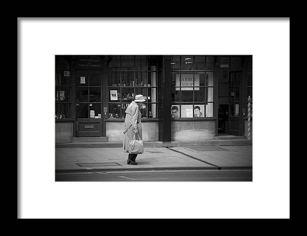 Loneliness Framed Print featuring the photograph Walking down the street by Chevy Fleet