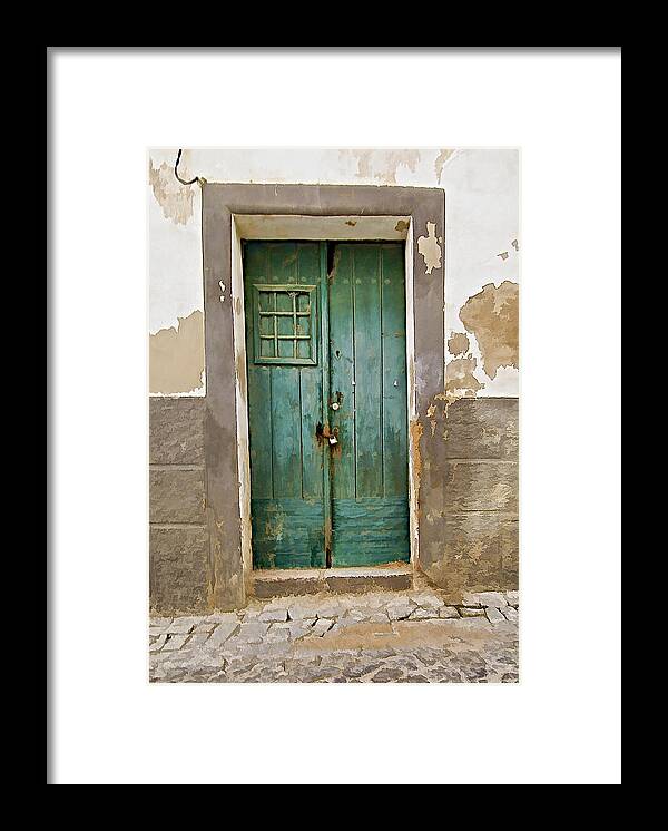 Canvas Framed Print featuring the photograph Weathered Green Door of Serpa by David Letts