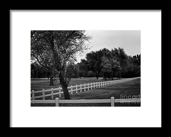 Black And White Framed Print featuring the photograph White Fence on the Wooded Green by Frank J Casella