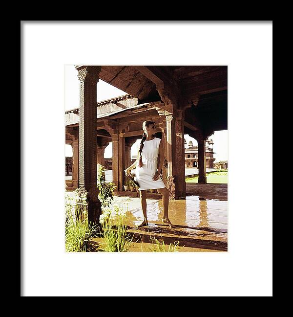 Fashion Framed Print featuring the photograph Wilhelmina Wearing A White Linen Dress by Henry Clarke