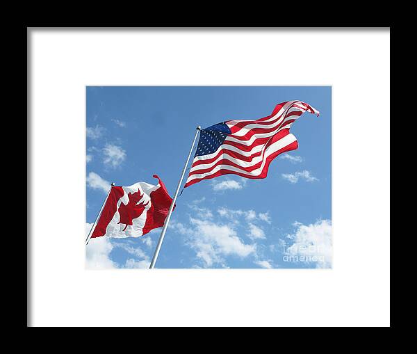 Flags Framed Print featuring the photograph Wind Whipped Flags by Ann Horn