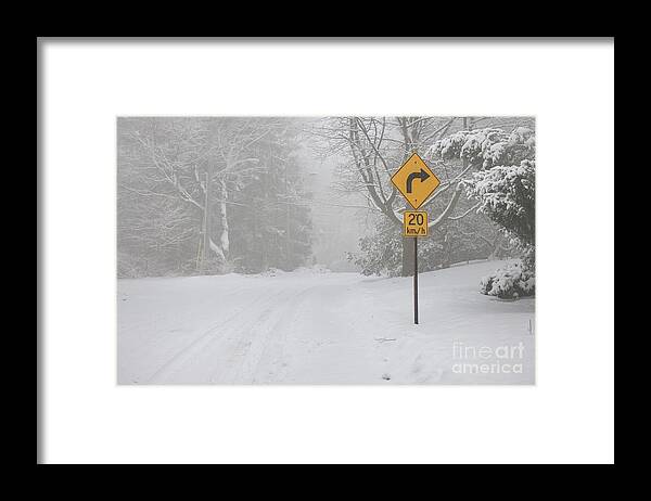 Winter Framed Print featuring the photograph Winter road with yellow sign by Elena Elisseeva