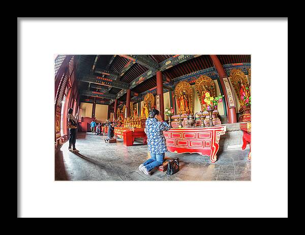 Chinese Culture Framed Print featuring the photograph Woman In Front Of Altar, Lama Temple by Peter Adams
