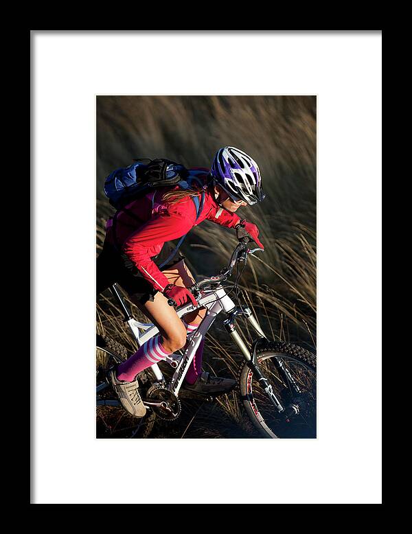 25-29 Years Framed Print featuring the photograph Woman Mountain Biking by Woods Wheatcroft