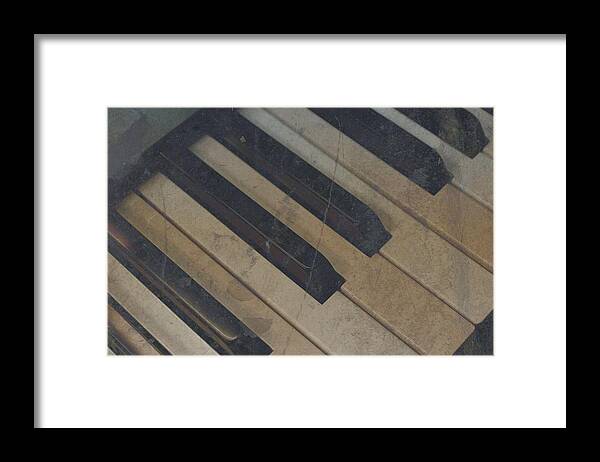 Piano Framed Print featuring the photograph Worn Out Keys by Photographic Arts And Design Studio