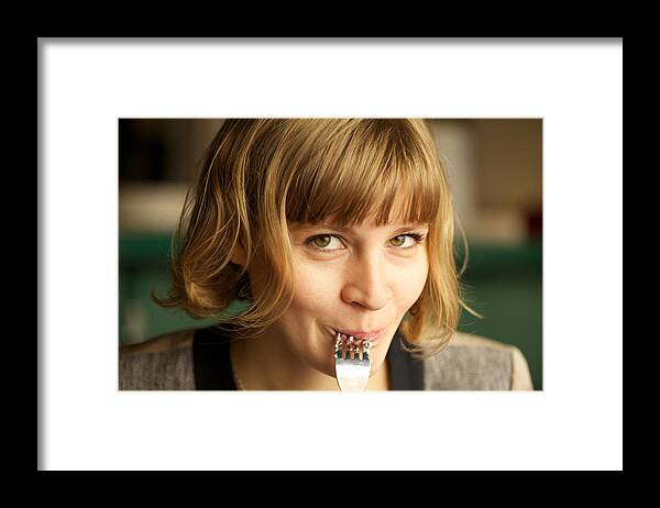 People Framed Print featuring the photograph Young woman enjoying food by Aleksandr Morozov