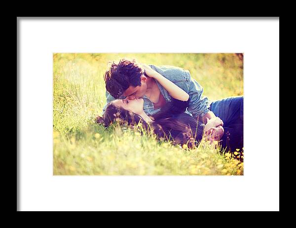 Young Men Framed Print featuring the photograph Youthful romance by PeopleImages