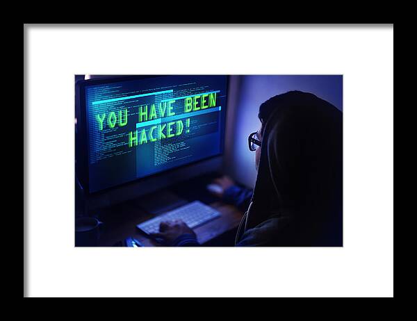 Young Men Framed Print featuring the photograph You've been hacked! by Yuri_Arcurs
