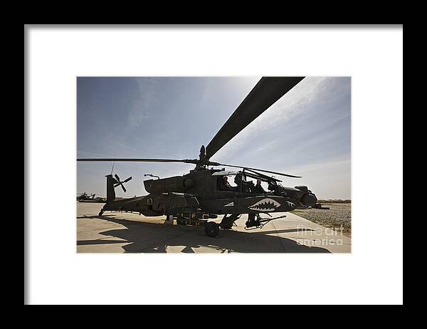 Ah-64 Framed Print featuring the photograph An Ah-64d Apache Helicopter Parked #1 by Terry Moore